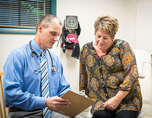 Dr. Coombes with a patient